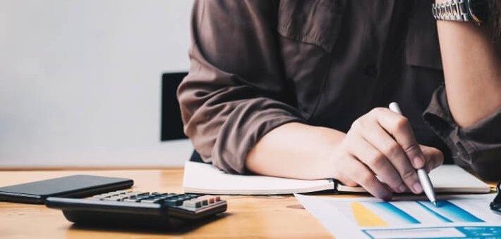 business woman verifying invoices