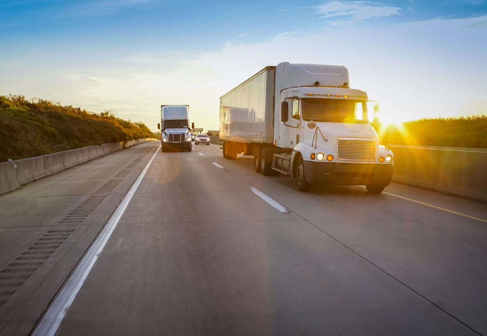 semi trucks driving on interstate