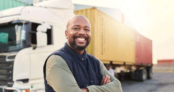 truck driver standing outside truck